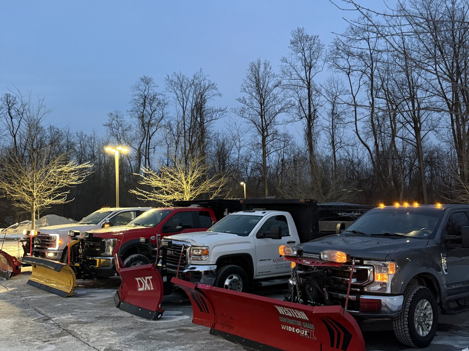The Aquilante Industries fleet of plow trucks lined up at dawn before a snow event